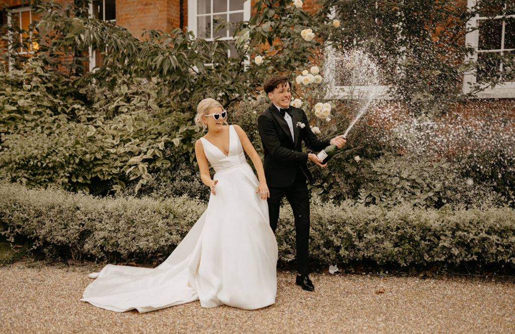 Champagne spray at a Surrey wedding venue