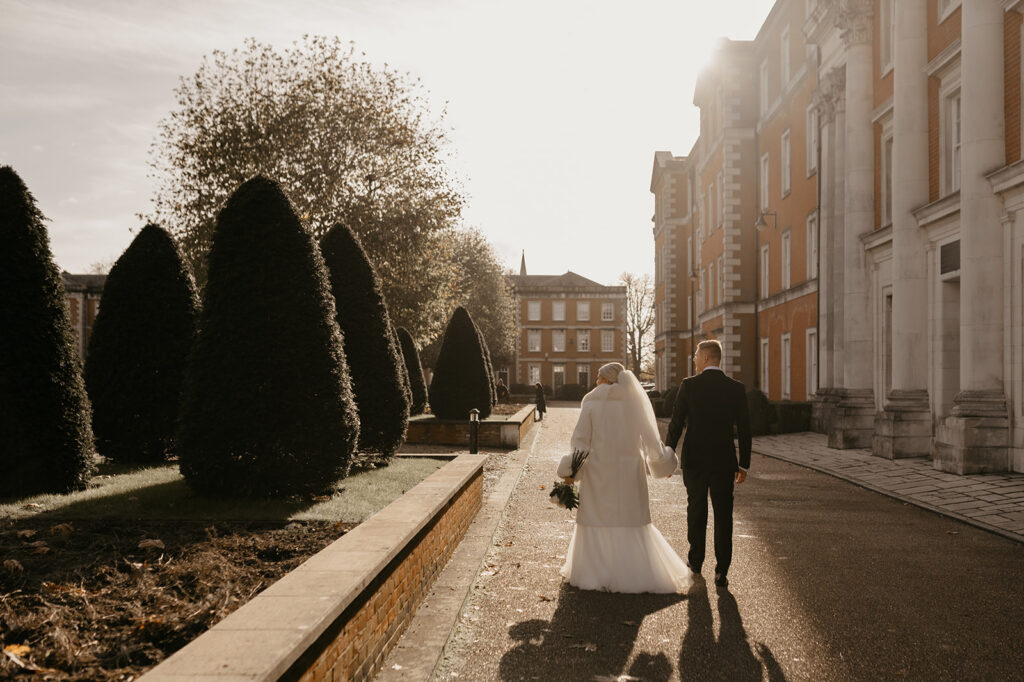 Winchester elopement photography. A couple walking through the street