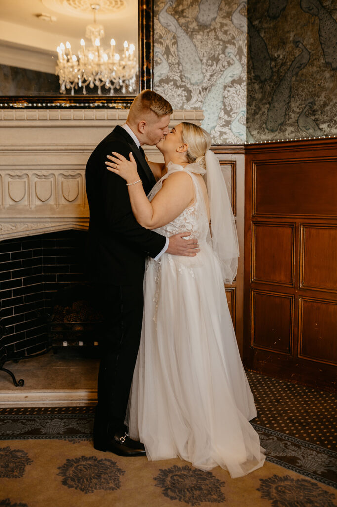 A newly married couple having their first kiss at Winchester registry office