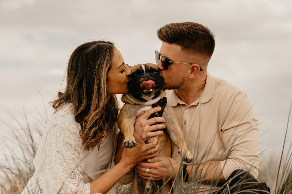 Beach couple photoshoot with their dog