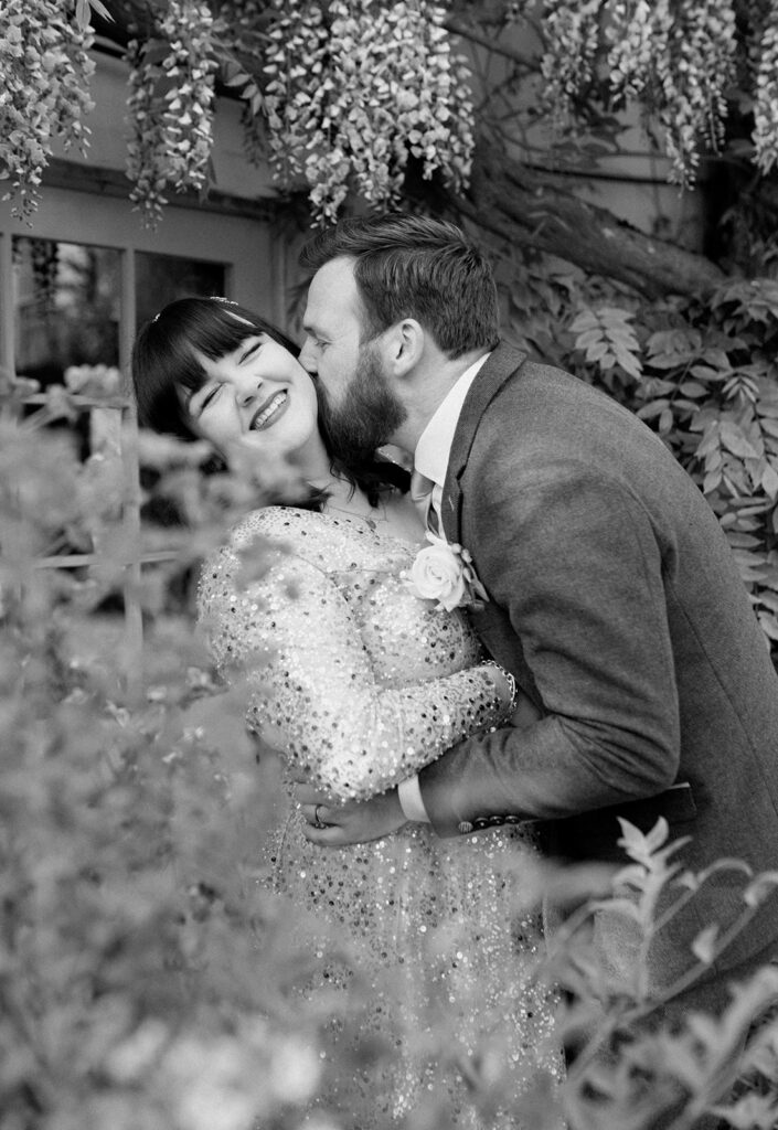 Relaxed black and white wedding couple portrait