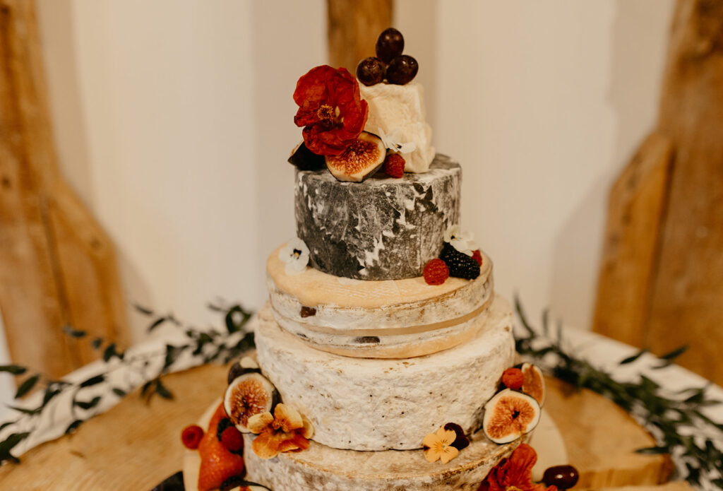 Tiered cheese cake with figs at a wedding