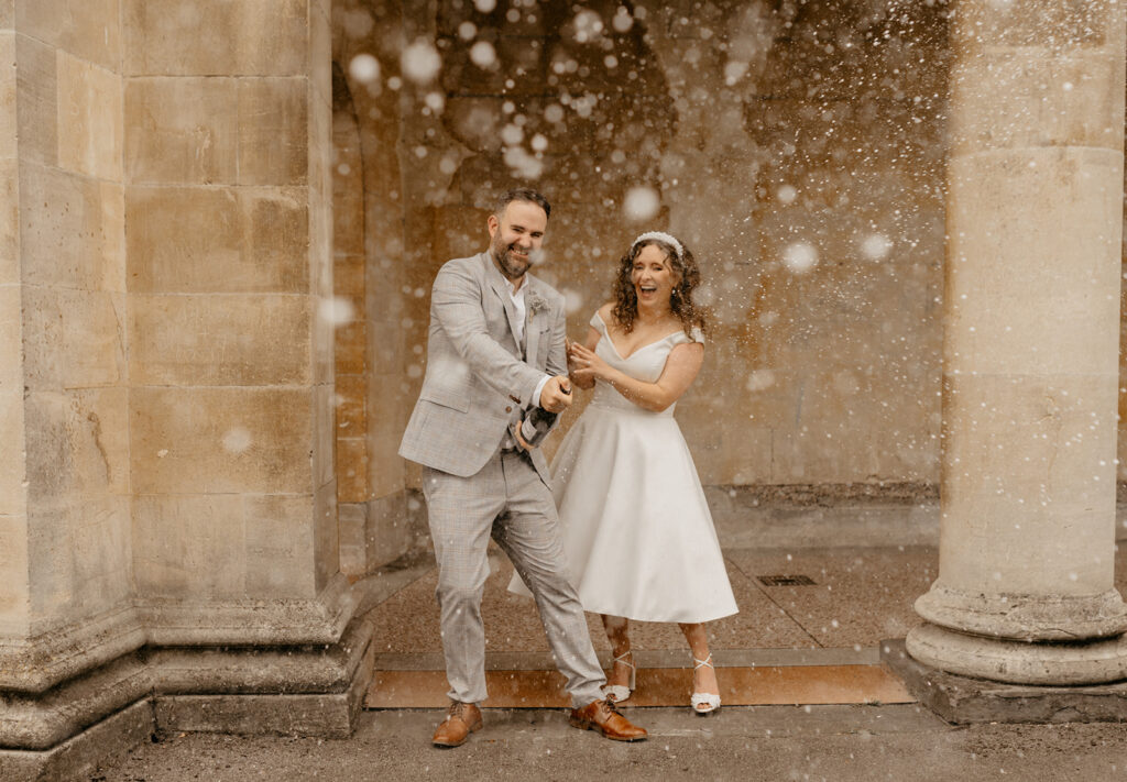 Champagne spray in a Bath elopement. Megan Donati Photography