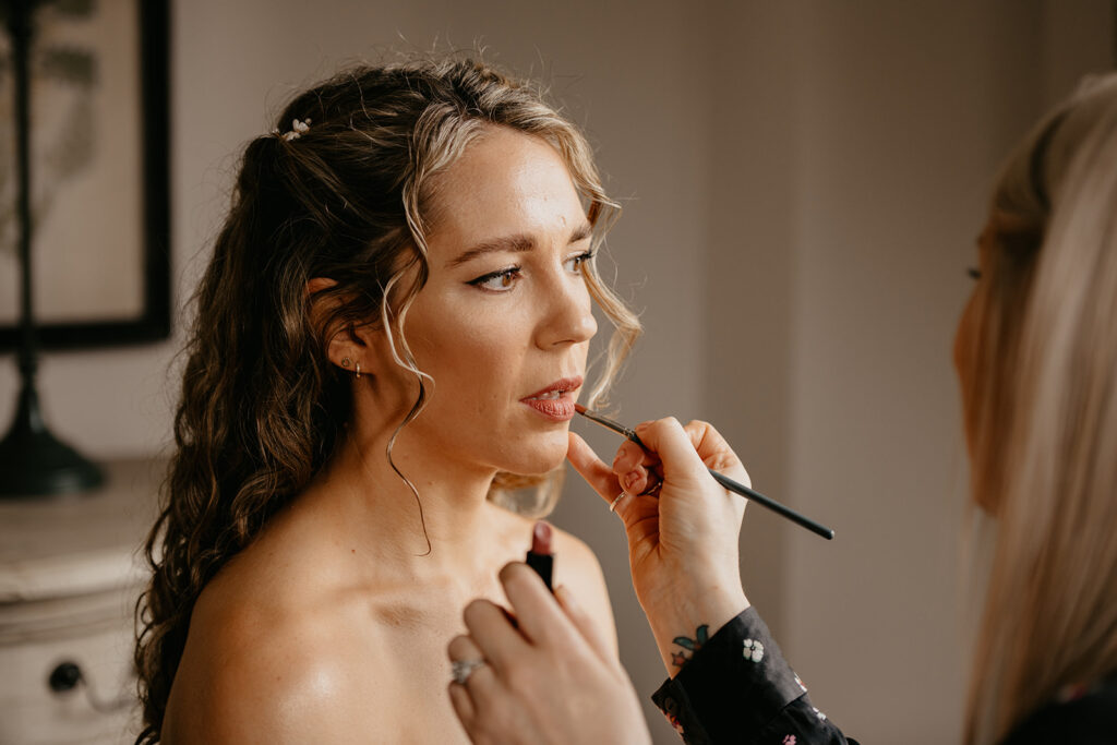 A bride getting ready for her wedding at Lillibrooke Manor