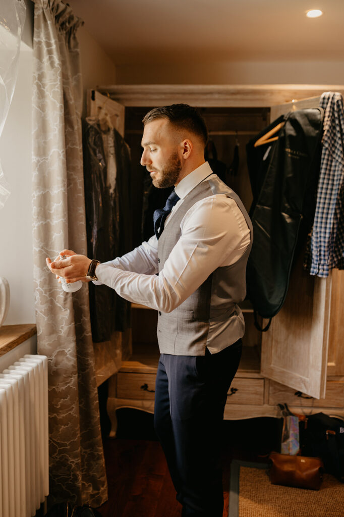 A groom getting ready for his wedding at Lillibrooke Manor