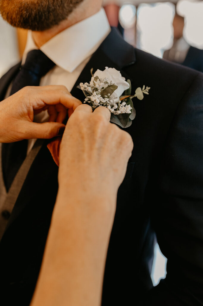 Lillibrooke Manor wedding white flower button hole