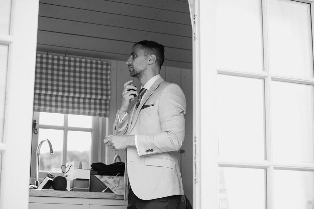 A groom getting ready for his wedding at Botley Hill Barn