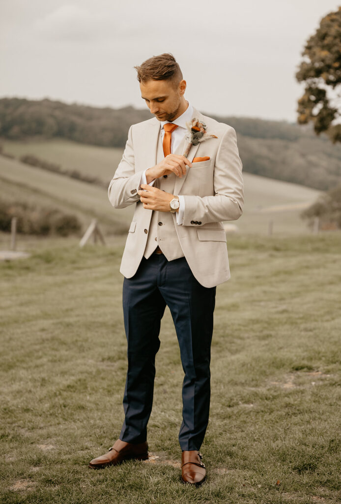 A groom getting ready for his wedding at Botley Hill Barn