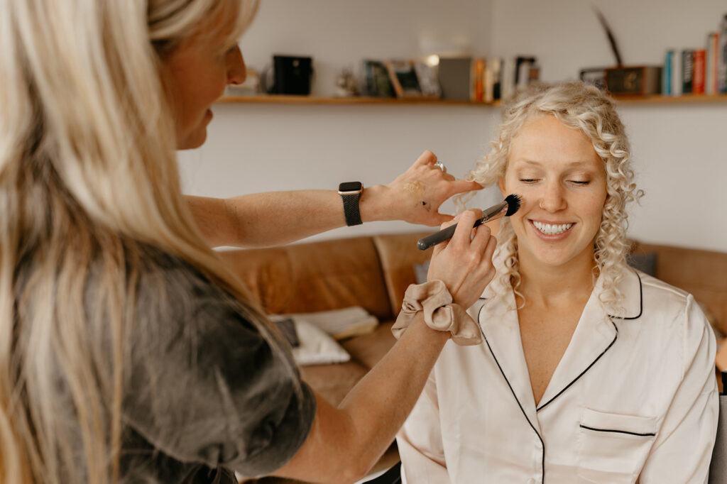 A bride getting ready for her wedding at Botley Hill Barn