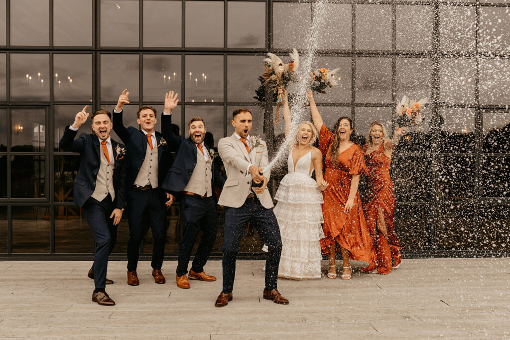 Champagne spray at a Botley Hill Barn wedding