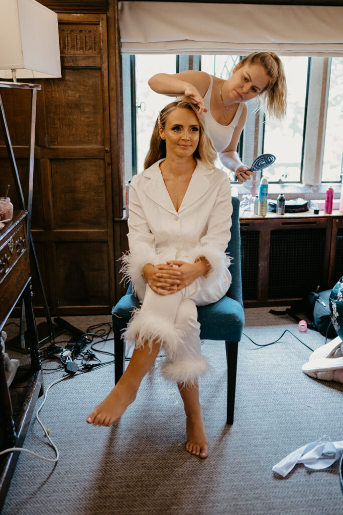 A bride getting ready for her wedding at Great Fosters