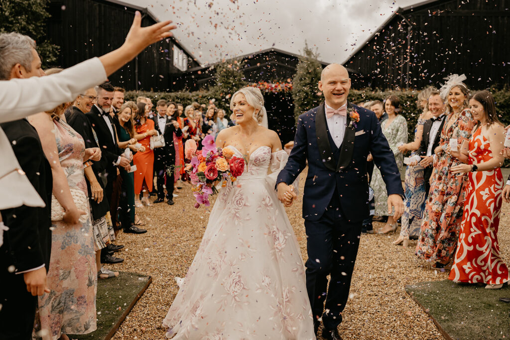 Colourful confetti at a Primrose Hill Farm wedding in the Cotswolds